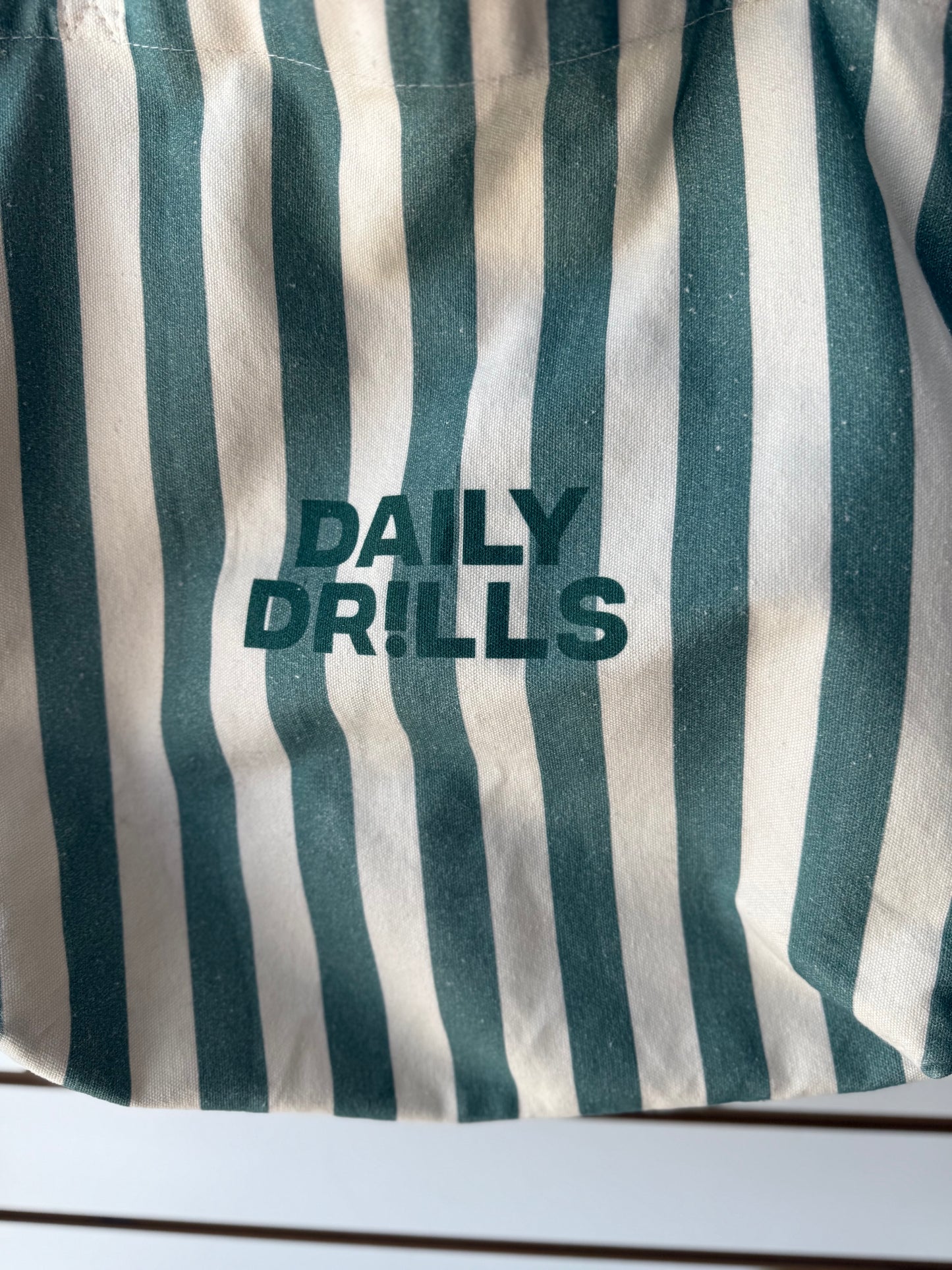 Daily Drills green striped canvas bag (has spotting)